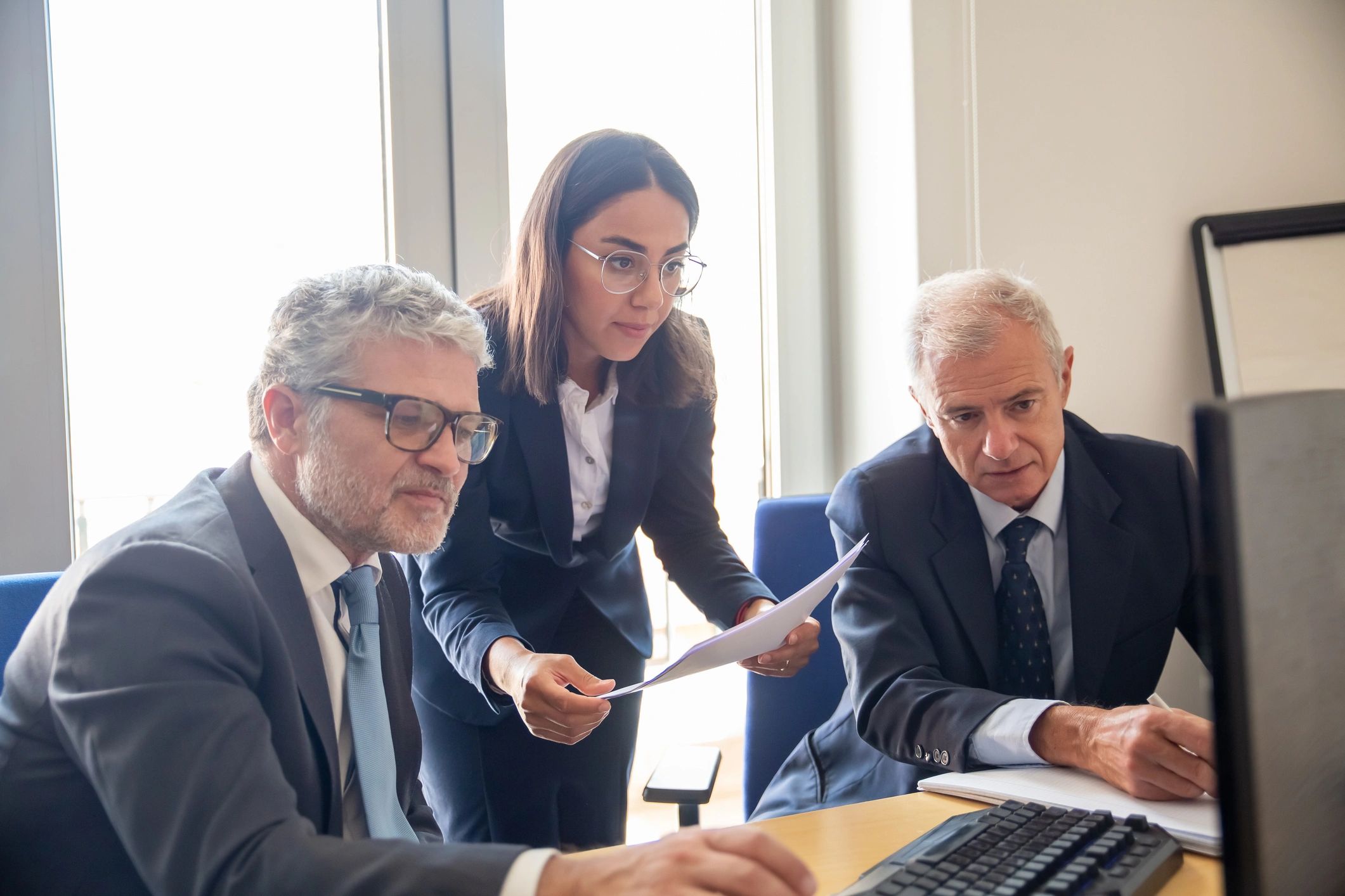 Advisor reviewing planning details with mature clients