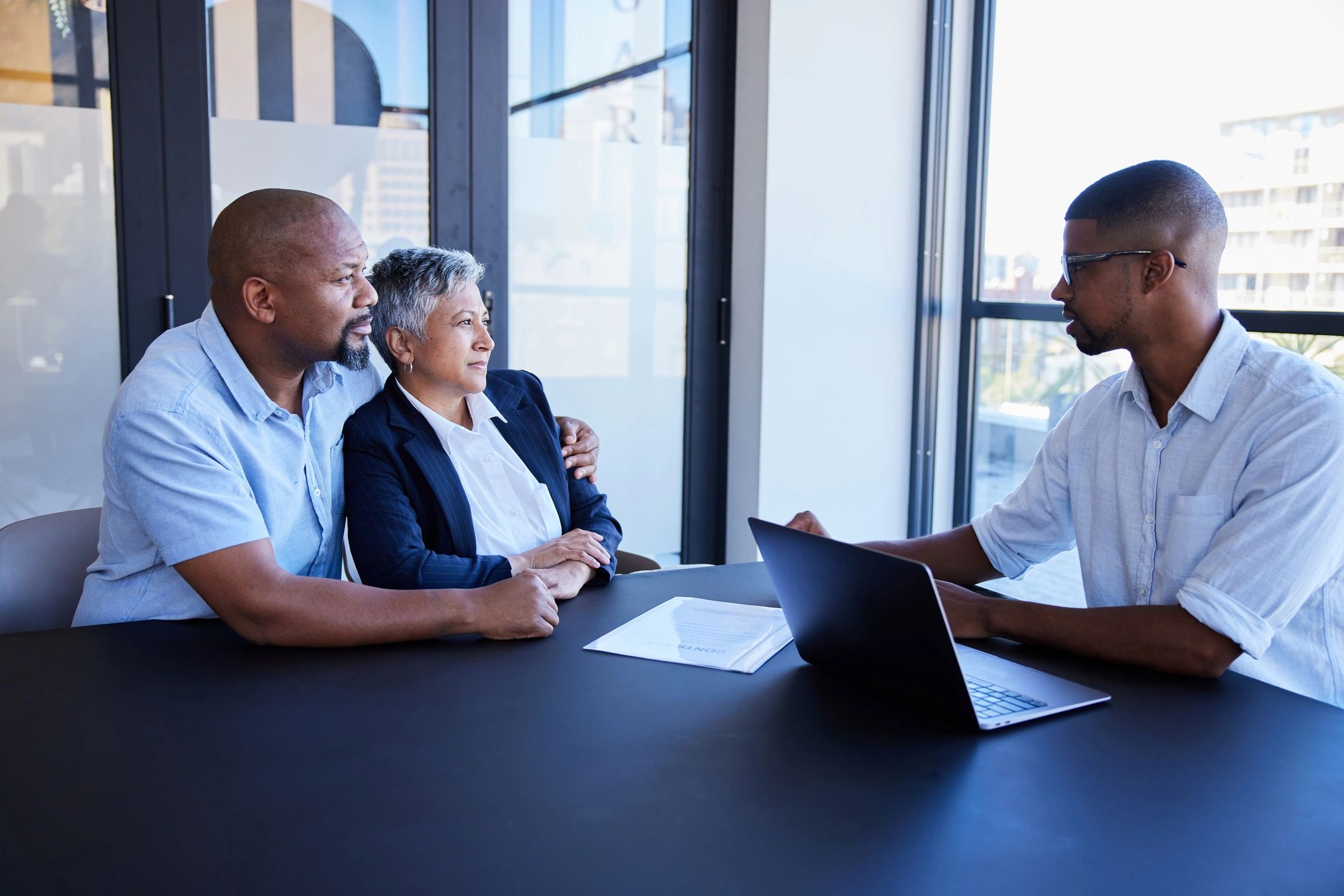 Mature couple reviewing annuity options with a financial advisor