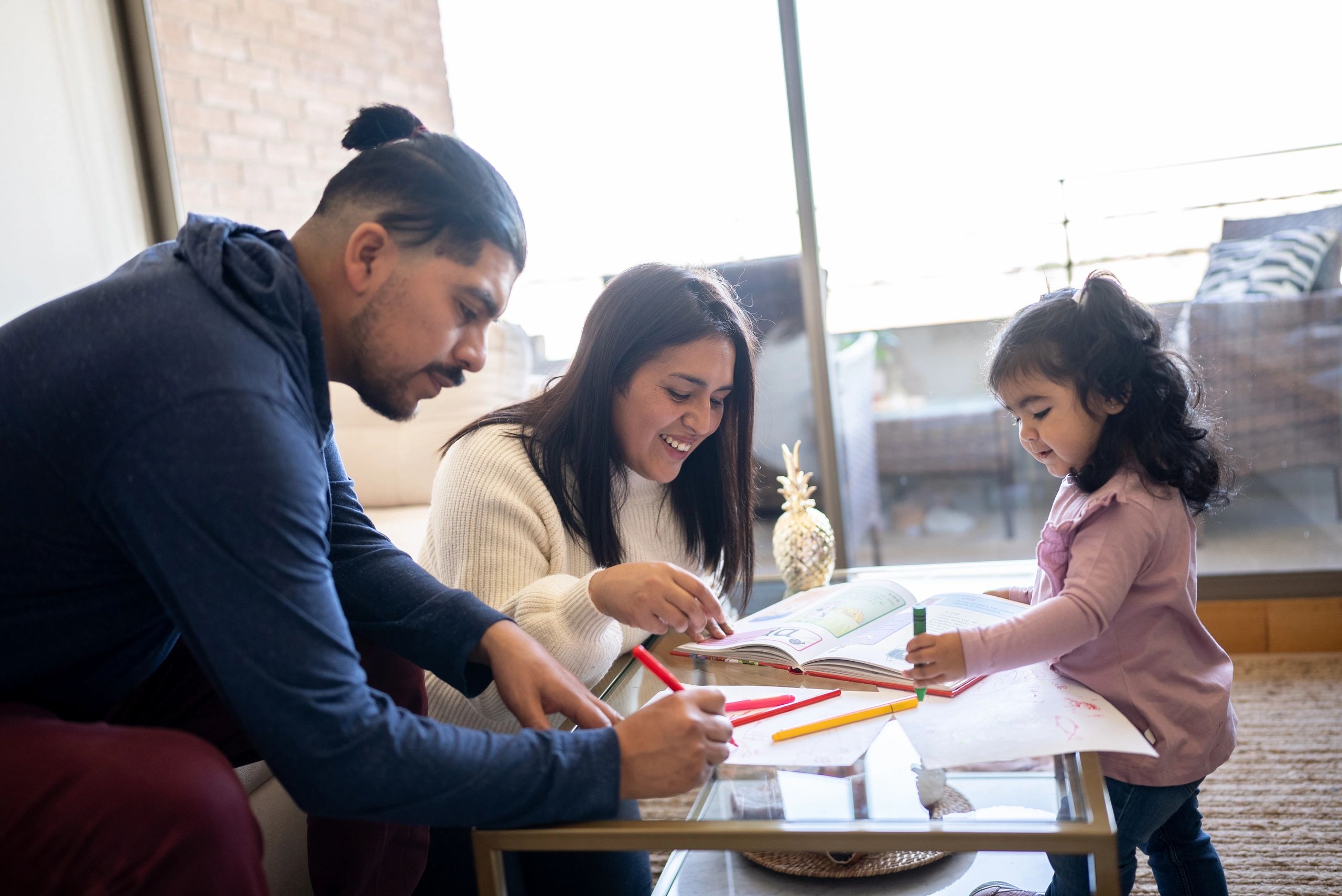 Parents and daughters spending time together at home