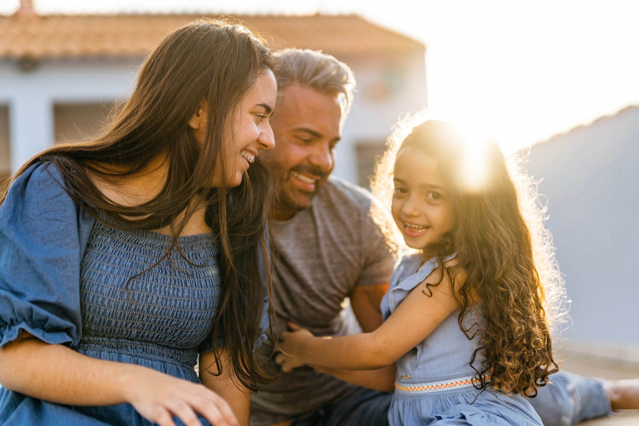 Father spending time with his daughters in the backyard