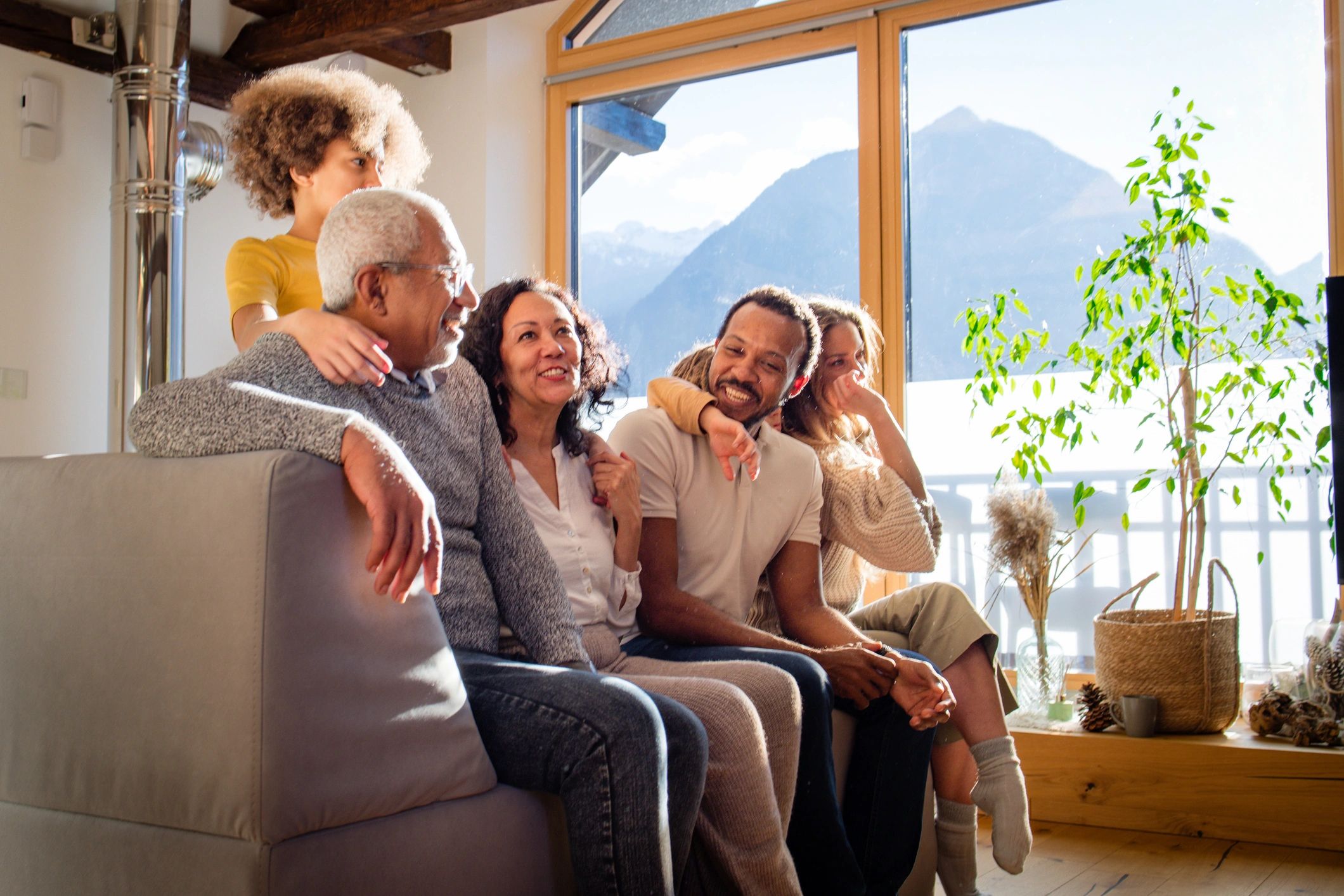 Large multigenerational family together in a living room