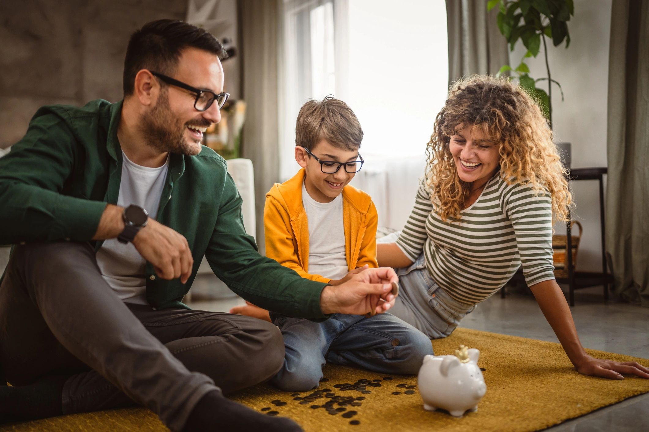 Family saving money together at home