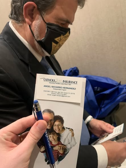 Angel Navarro Hernandez credential card shown during an insurance event